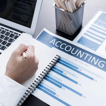 accounting Businessman analyzing investment charts with laptop. Accounting; Shutterstock ID 364341248